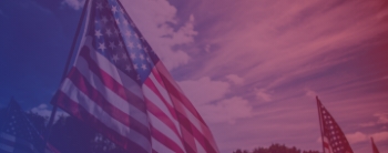 American flags against a cloudy sky