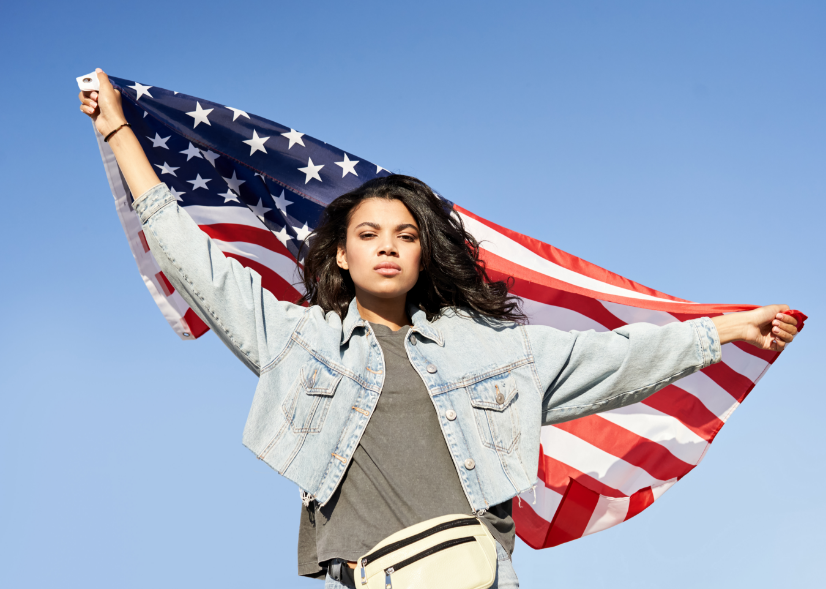 A woman holding an American flag